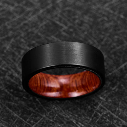 Tungsten and wood ring with a black band and natural Mahogany wood interior.