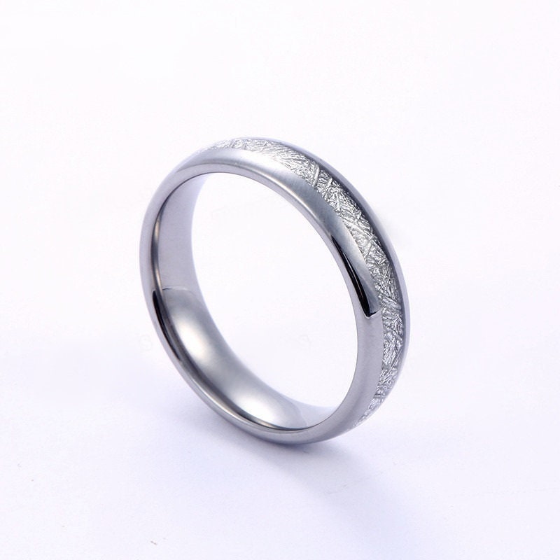 Tungsten meteorite wedding bands with polished silver finish.