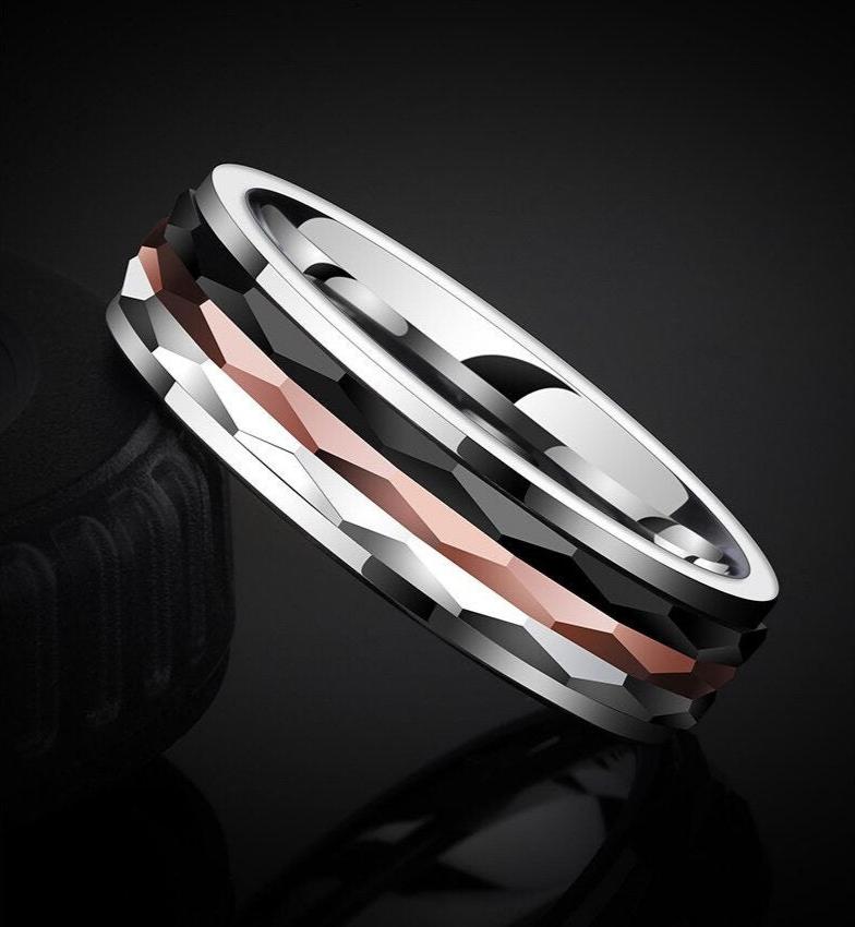 Men's Tungsten spinner ring featuring silver, black, and bronze Tungsten center spinners on a polished silver Tungsten band.