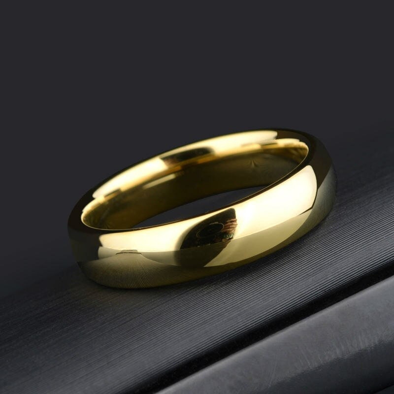 Polished Tungsten wedding rings vs gold with a 5mm width, domed shape.