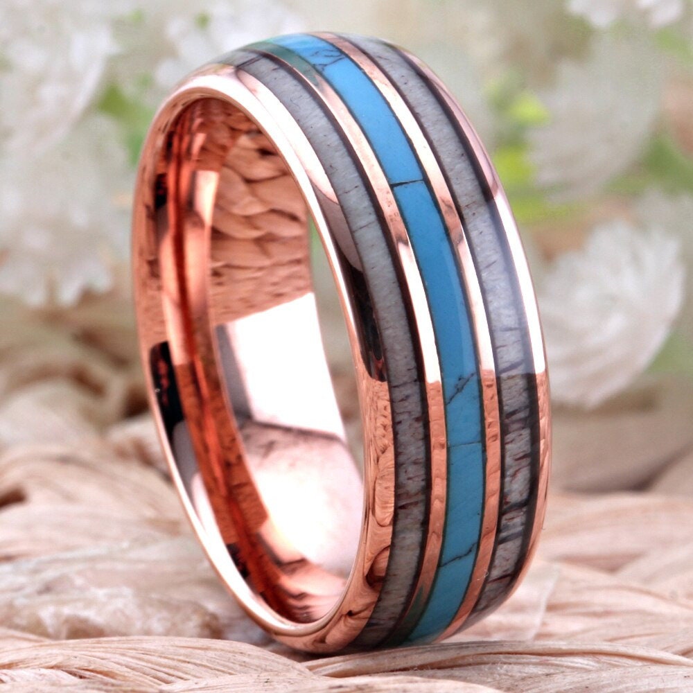 Turquoise and elk antler inlay ring crafted with an 8mm rose gold Tungsten band.