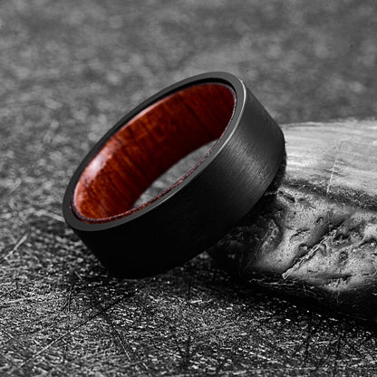 Wooden wedding rings featuring black Tungsten with a Mahogany wood interior.