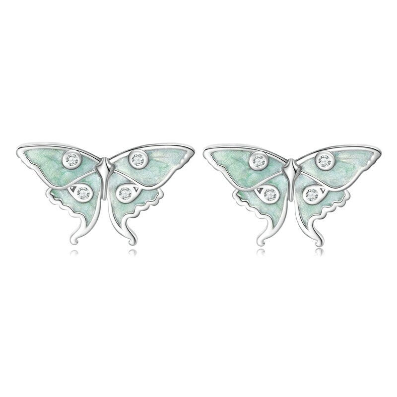 Tiny woodland-inspired moth studs in 925 sterling silver with shimmering clear cubic zirconia details.